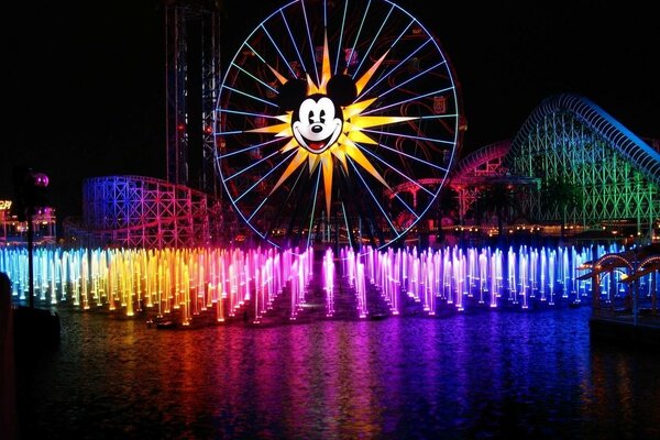 Grande roue sur fond de fantans colorés