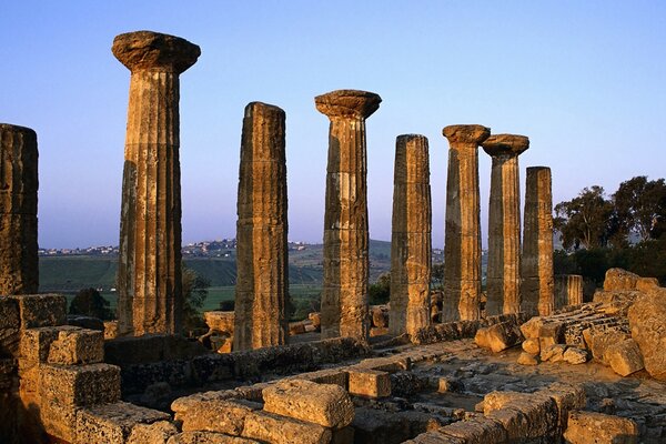 Ancient ruins against a purple sky