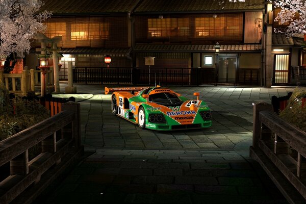 Sporty green with orange car at night