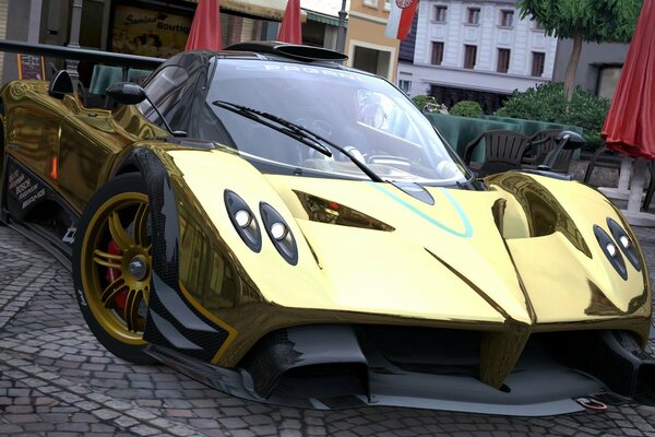 Coche de carreras de color dorado cerca de la cafetería