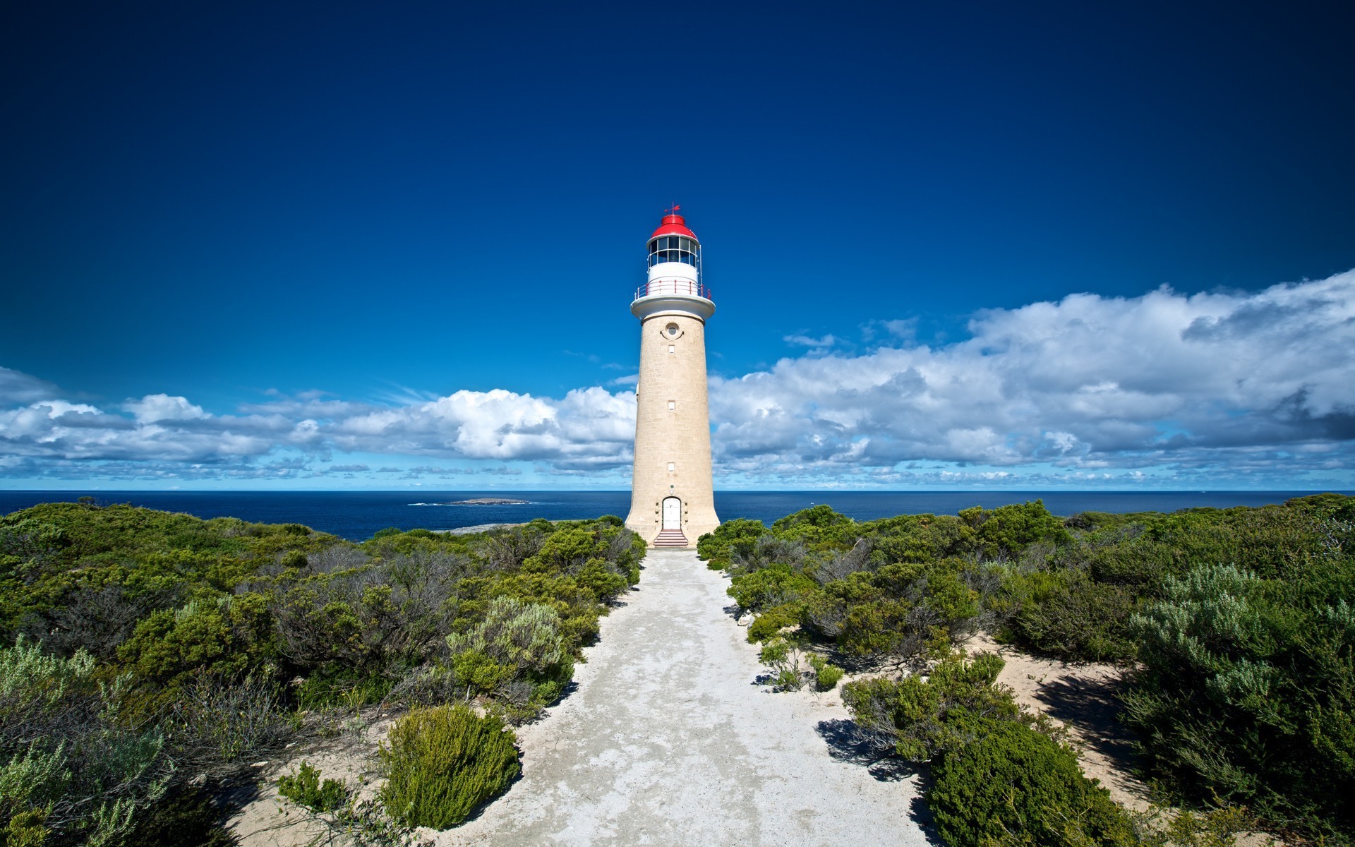 beacons lighthouse sea sky seashore ocean beach water landscape travel outdoors nature seascape rock island tower