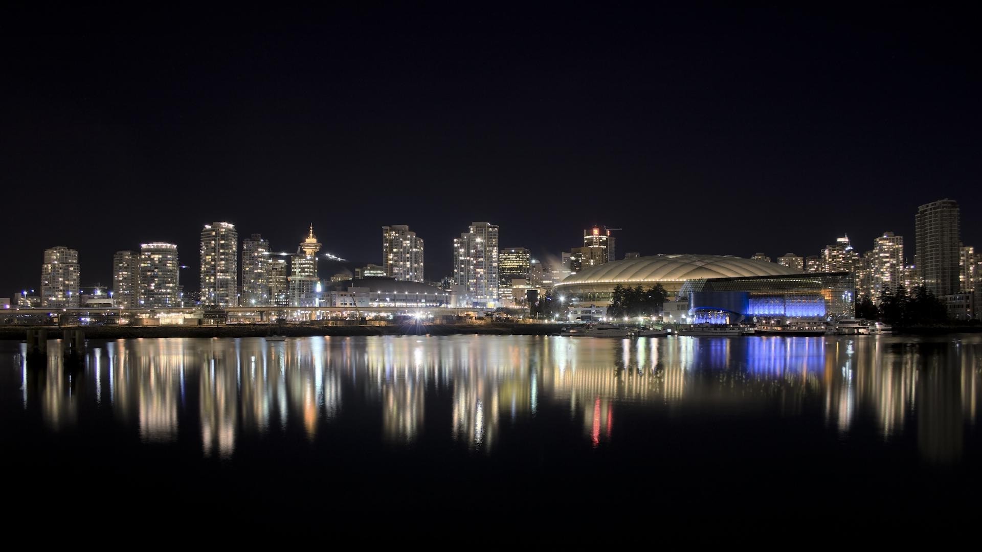 city skyline downtown water cityscape architecture reflection sky river sunset travel harbor dusk evening urban building skyscraper bridge waterfront modern