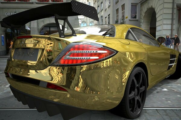 The golden Mercedes is on display on the street