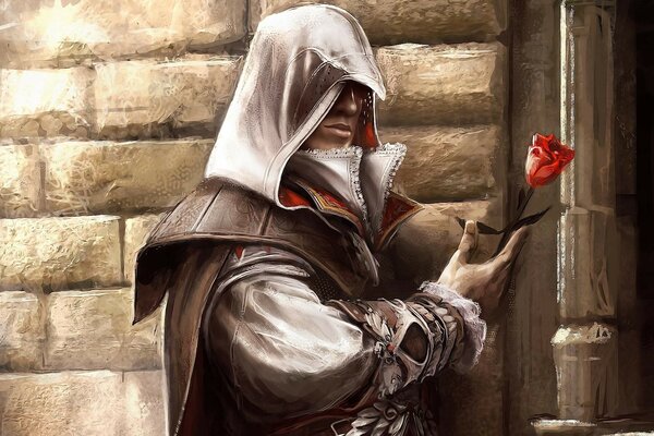 A hooded man holding a rose in his hand