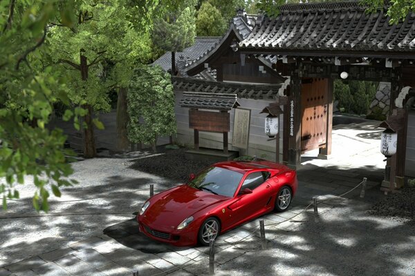 A red racing car is parked near an open gate