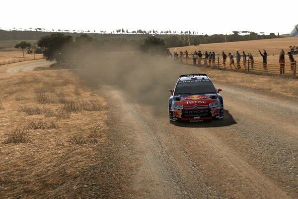 A racing car is rushing along the track