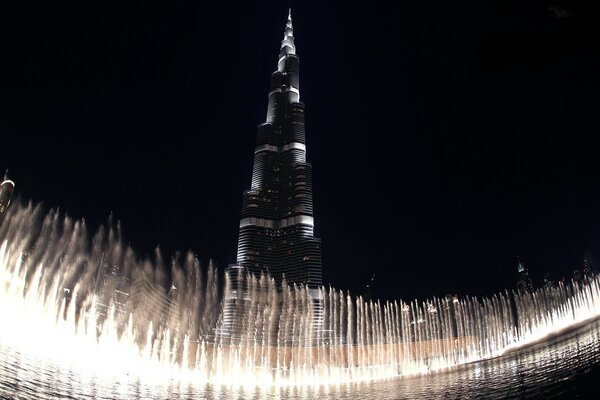 A tall tower on the background of a fountain