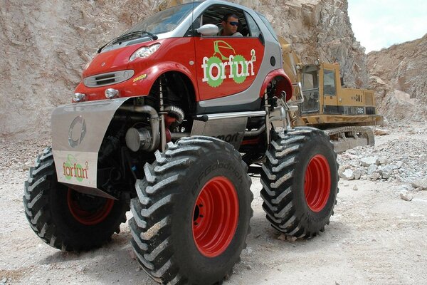 Red all-terrain vehicle on big wheels