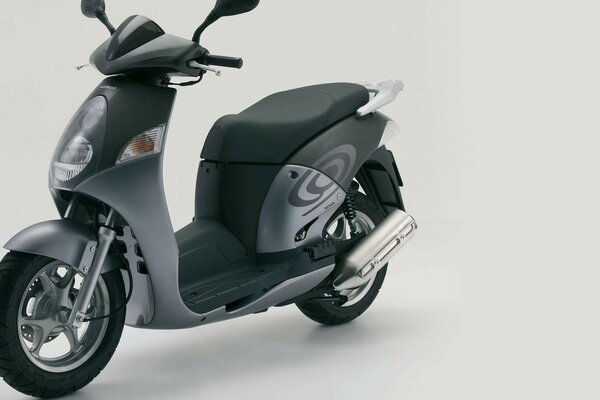 Grey moped on a grey background