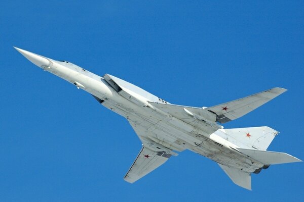 A fighter taking off with red stars on the wings