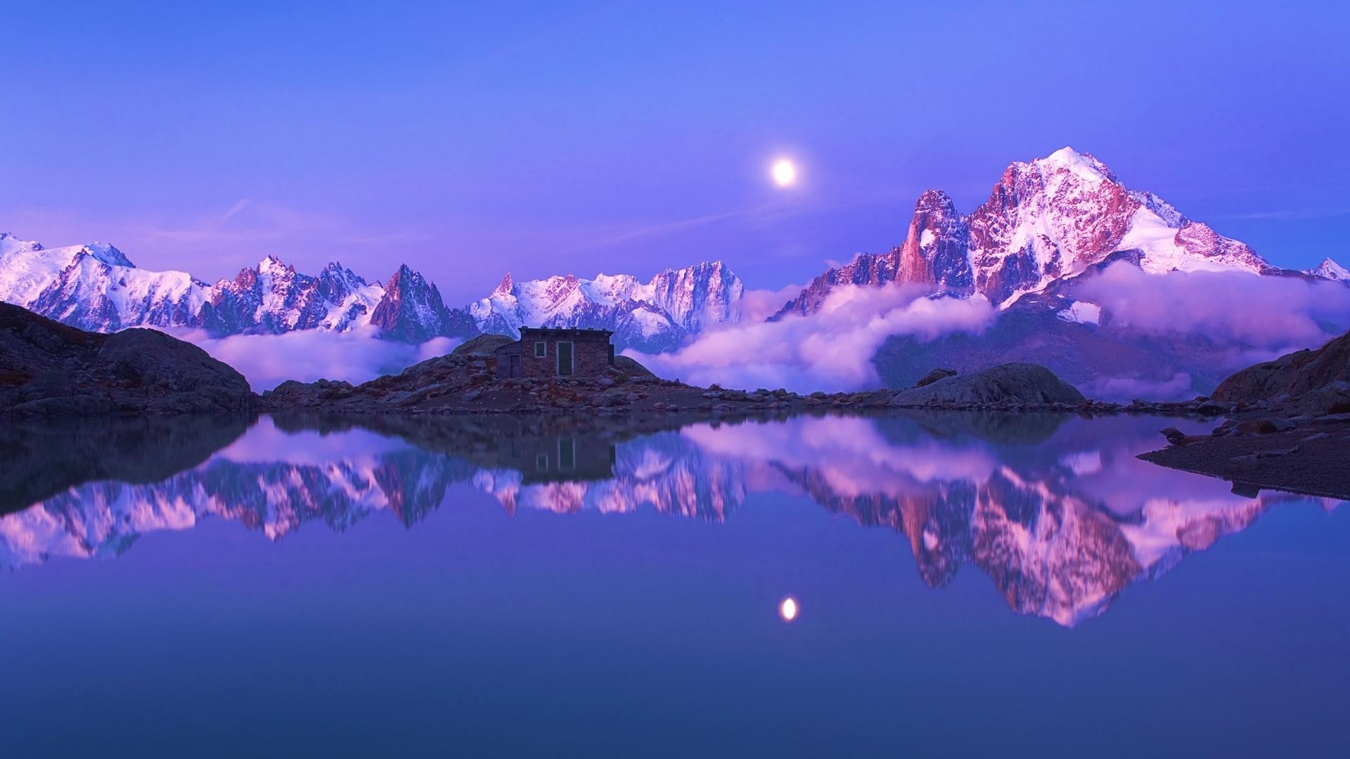 rocks boulders and stones snow mountain landscape winter travel evening dawn water sky sunset reflection