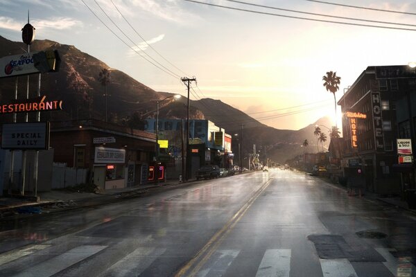 A road with houses and mountains