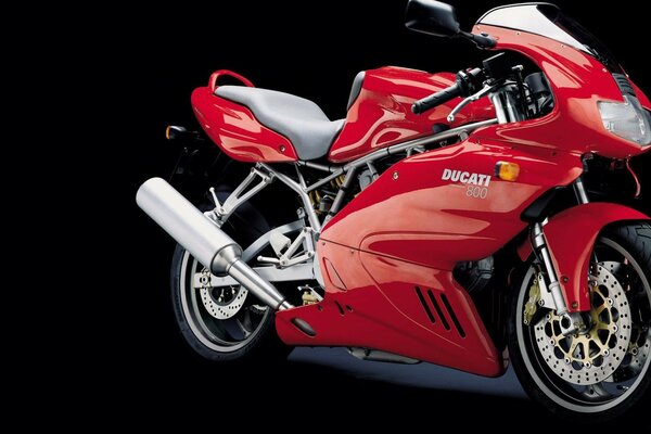 Red sports bike on a black background