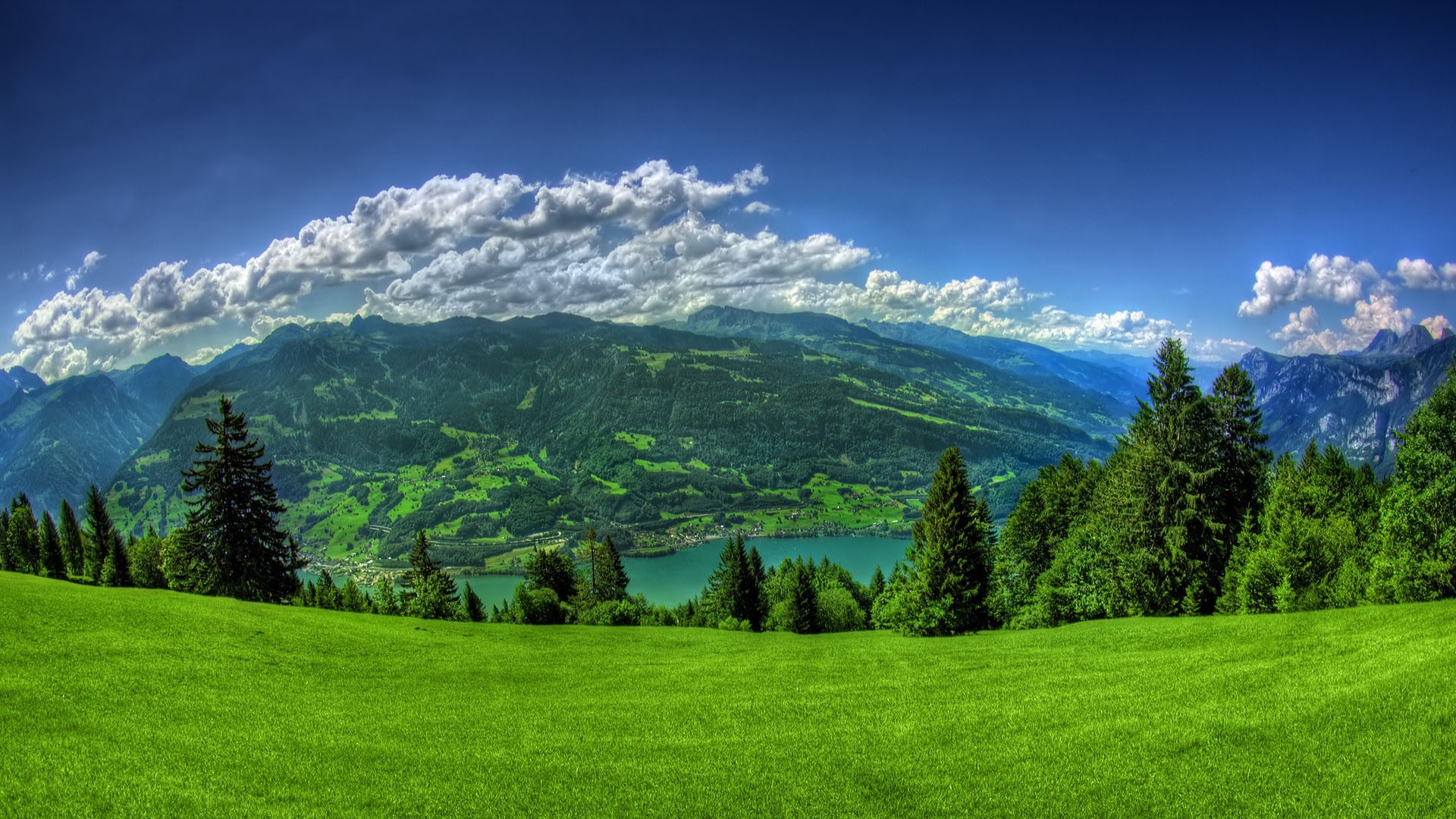 rivers ponds and streams landscape grass nature hayfield tree wood sky outdoors hill mountain rural summer fair weather countryside grassland cloud scenic field travel