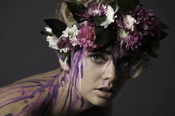 Body art woman with a wreath of flowers on her head