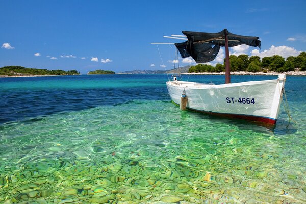 White boat in the turquoise ocean