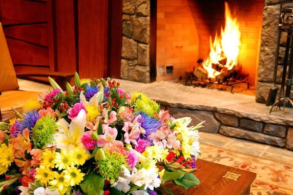 Cozy fireplace and beautiful flower arrangement