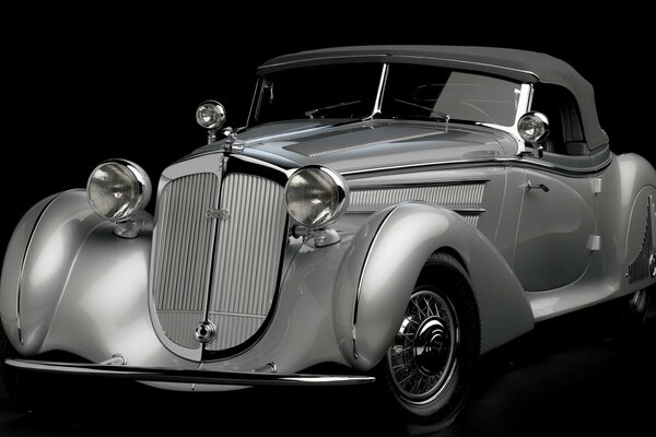 Silver retro car on a dark background