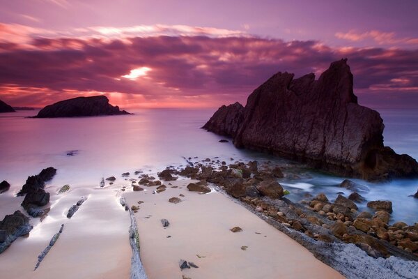 Pink sunset sea and mountains