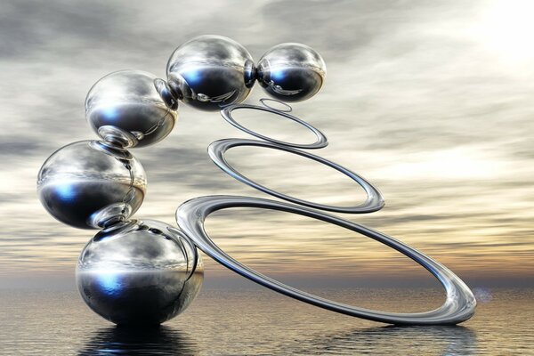 Silvery spheres on a gray sky background