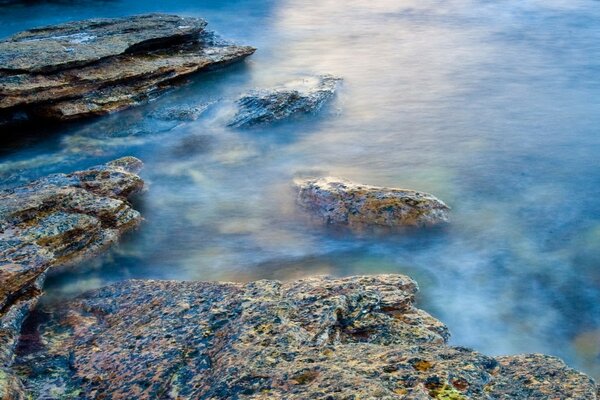 The sea washes the rocks on the shore