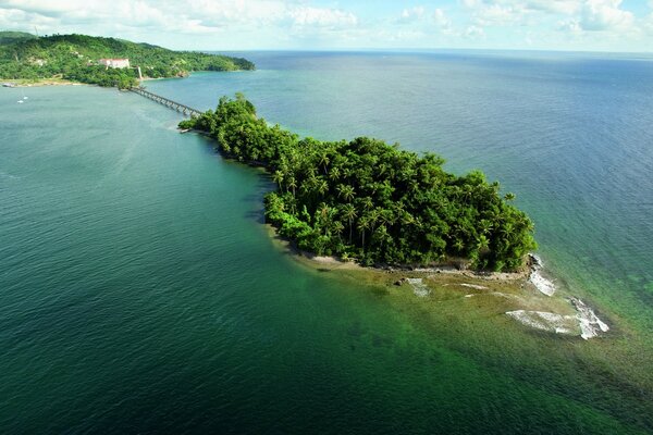 Green island in the middle of the sea