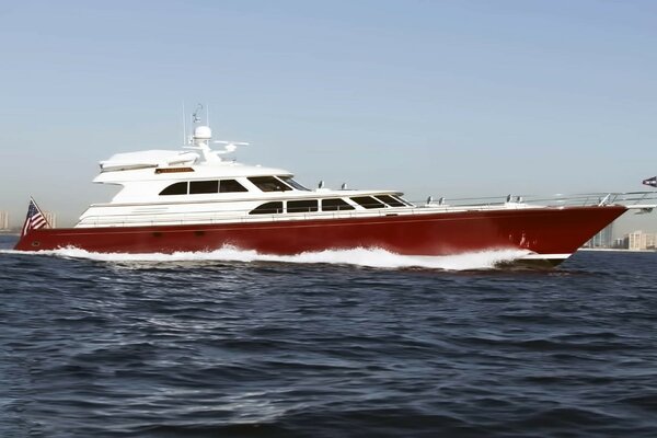 White and red yacht with the flag of America