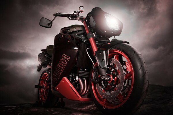 Black and red sports motorcycle on a dark background