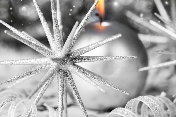 Christmas toys on a candle background