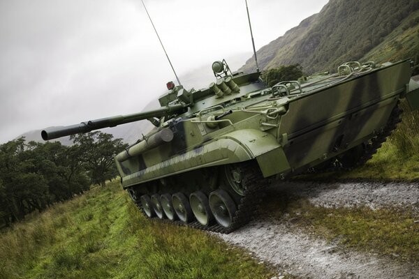 A military tank is standing at the landfill