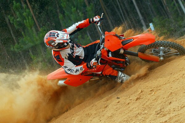 Motorcyclist in motion on the sand