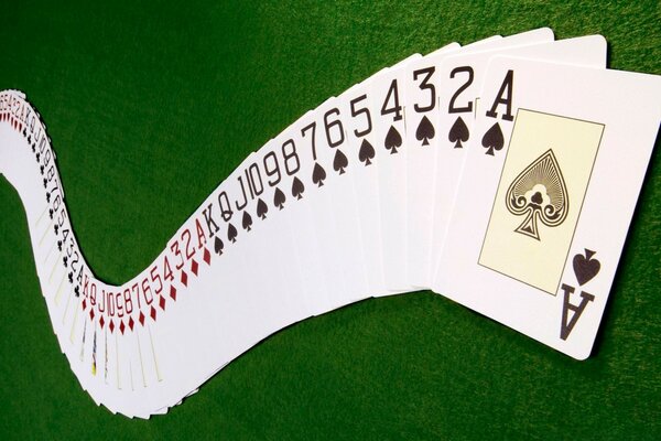 A deck of cards spread out like a snake