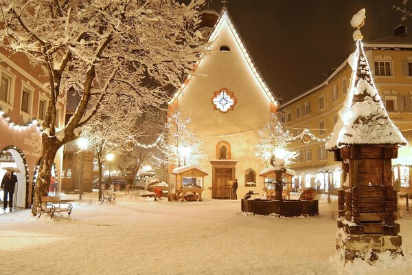 A moment of a sleeping snow-covered town before Christmas