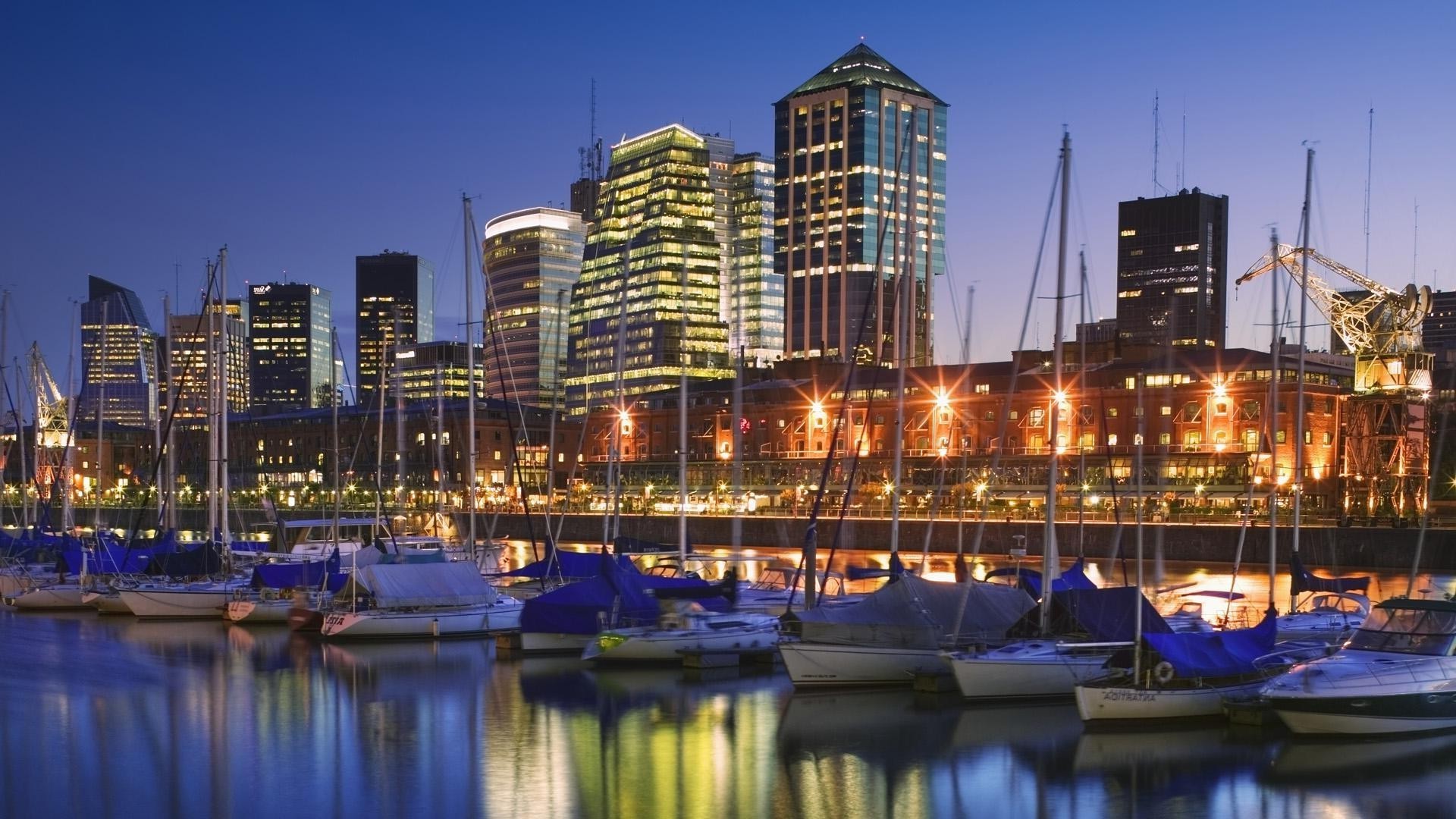 city water travel sky architecture building river reflection urban cityscape waterfront dusk marina skyline harbor downtown evening bridge modern pier