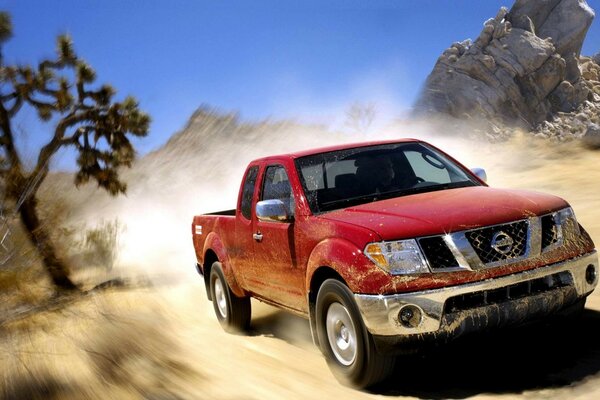 Red SUV in a deserted field