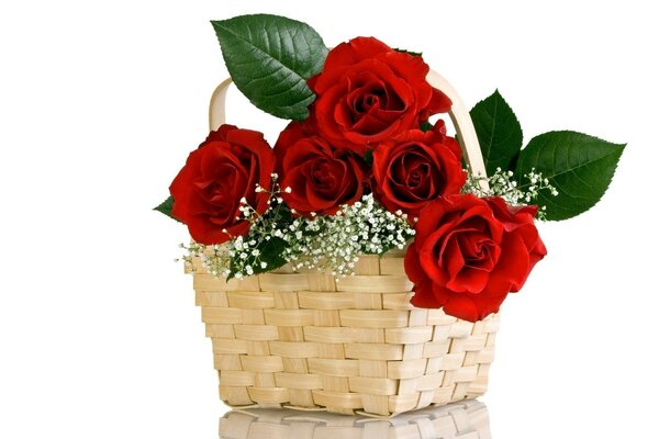 Basket with a bouquet of red roses as a gift