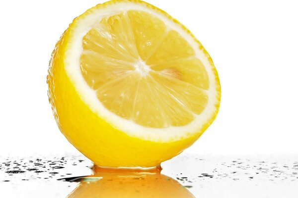 Half a lemon on a glass table