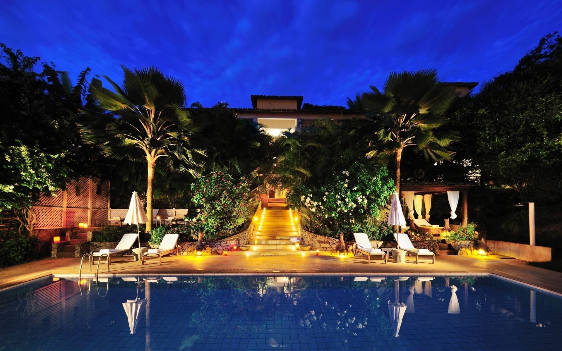 pools hotel resort travel luxury pool swimming pool vacation water tree palm chair tropical villa swimming poolside outdoors beach ocean relaxation