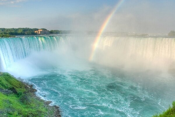 Waterfall and water and rainbow with them