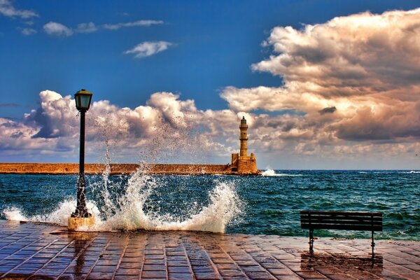 Waves break on the embankment