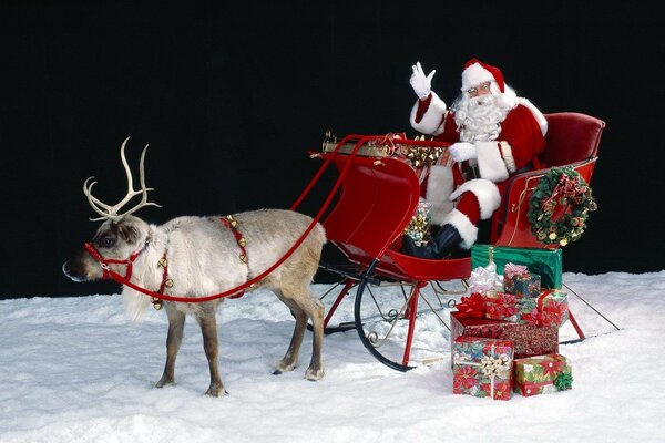 Santa Claus on a sleigh carries gifts