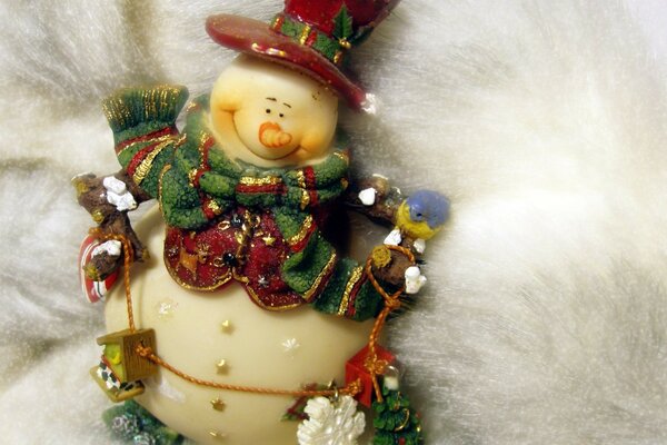 Cheerful good-natured snowman on a white background