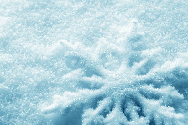 Macro shooting of snowflakes in a pile of snow