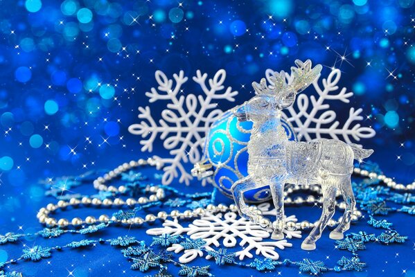 Crystal deer on a blue Christmas background