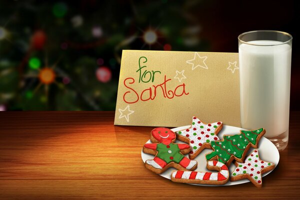 A letter for Santa with cookies and milk