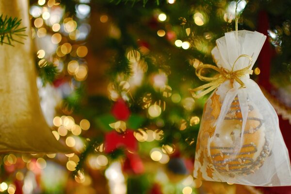 Macro shooting of a Christmas tree with toys and garlands