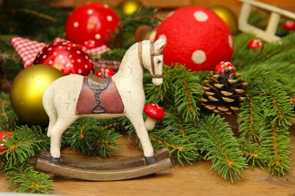 Wooden horse on the background of Christmas toys