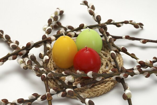 Willow twigs and three colorful candles