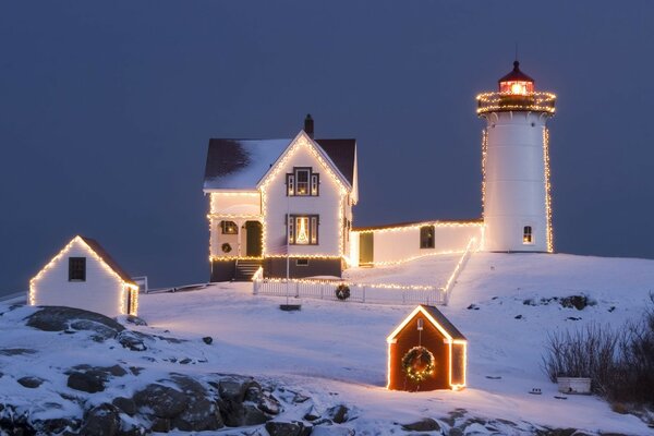 Winter houses with yellow garlands