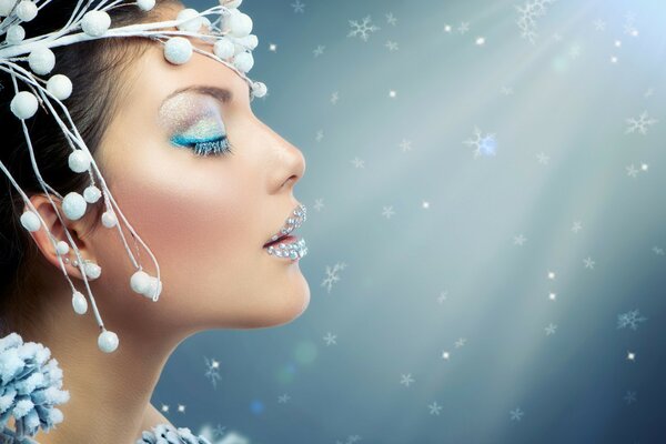 A model with makeup in the style of the snow queen